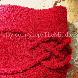May include: A close-up of a vibrant red, textured fabric with a woven design. The fabric is thick and plush, with a soft, fuzzy appearance. The text "www.etsy.com/shop/TheMiddleButton" is visible on the fabric.