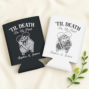 May include: Black and white can coolers with the text "'TIL DEATH Do Us Part" and the names "Sophia & James". The design features two skeletons embracing. One cooler is black, the other is white.