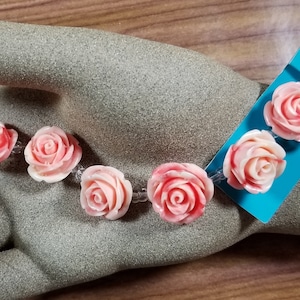 FF-165; A String Seven Acrylic Peach Roses Separated with Clear Glass Beads