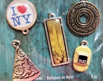 C-111; A Set of Five New York Charms- A Yellow Cab, Slice of Pizza, Subway Token, Empire State Bld and I Love N Y