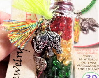 OJN-202; Jewelry Kit in a Bottle-Beads of Maroon, Cream, Green, and Blue with Accents of Silver Elephant Charm and Beads with Tassels