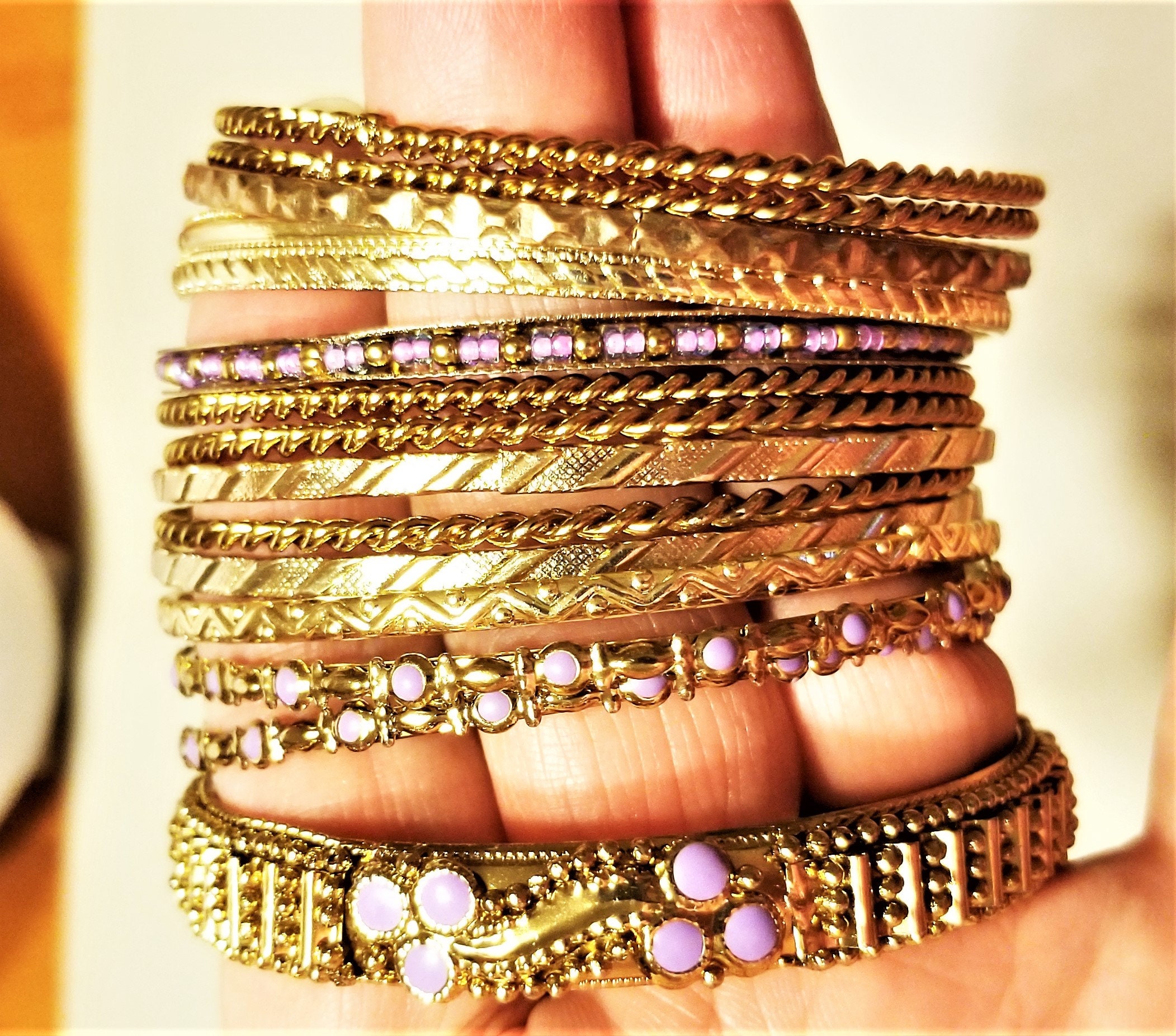 OJB-171: A Set (15) of Gold Tone Bangle Bracelets Some With 