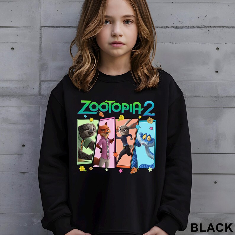 May include: Black sweatshirt with the text "ZOOTOPIA 2" and a graphic of four animated characters in colourful rectangular panels. The word "BLACK" is printed at the bottom right of the sweatshirt.