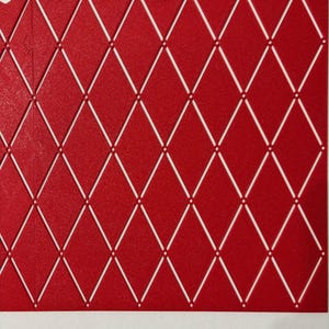 May include: Red paper with a white diamond pattern. The diamonds are outlined in white and have a small white dot in the center.