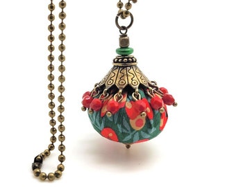 long necklace in Liberty of London fabric in Christmas colors, glass beads and bronze metal