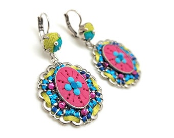 Hot pink earrings with blue embellishments, jewel from embroidered filigrees and polymer clay