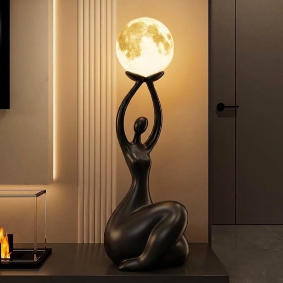 A sculptural Moon Goddess resin figure that doubles as a moody ambient lamp — the kind of piece that anchors a whole room's aesthetic.