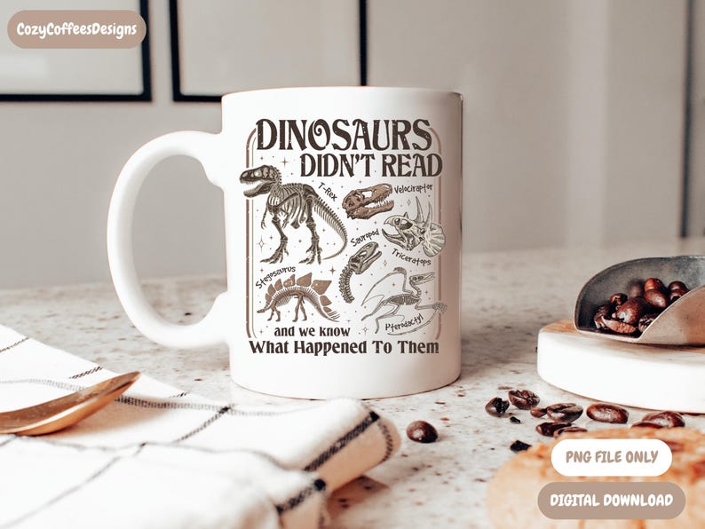 May include: White ceramic mug featuring a dinosaur-themed design with the text "DINOSAURS DIDN'T READ" and illustrations of various dinosaurs. The mug also includes the text "and we know What Happened To Them."