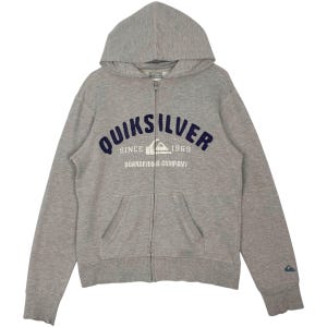 May include: A gray zip-up hoodie with a hood and a kangaroo pocket. The front features the text "QUIKSILVER" in navy blue, with "SINCE 1969" and "BOARDRIDING COMPANY" below. A small logo is on the left sleeve.