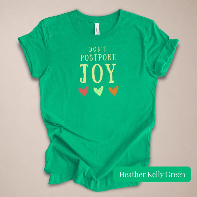 Motivational Quote Tee Women Positive Message Shirt Dont Postpone Joy Graphic Design Inspirational Top Happy Vibes Joyful Apparel Mental Health Gift Meaningful Message Uplifting Design Casual Comfort Style Daily Motivation Wear Self Care