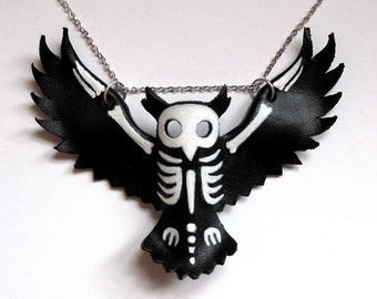 Leather owl skeleton silhouette pendant statement necklace, hand painted in acrylic with a white gold-plated chain, by Eden Bachelder
