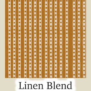 May include: A close-up of a fabric with a repeating pattern of vertical lines in a mustard yellow color. The lines are interspersed with small, off-white square shapes. The words "Linen Blend" are at the bottom of the image.