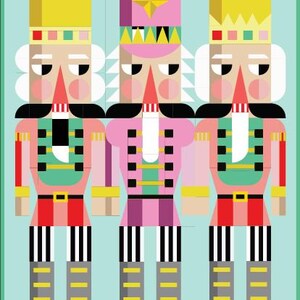 May include: A graphic illustration of three nutcracker figures arranged side-by-side against a light blue background. The figures feature geometric shapes in shades of pink, yellow, red, black, white, and green, wearing crowns and tall hats.