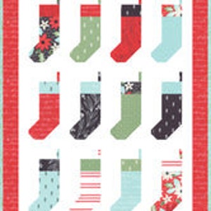 May include: Twelve Christmas stockings in various patterns and colors, including red, green, blue, white, and black. The stockings are arranged in three rows of four, with a white background and a red border.