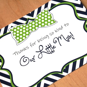 May include: A thank you card with a green and white bow tie design and the text "Thanks for being so kind to our little man!" printed on a black and white chevron background.