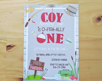 May include: A fishing-themed first birthday party invitation for a boy named Coy. The invitation features a cartoon fishing rod, a red and white bobber, and a sign that says "Gone Fishing!" The invitation text reads "Coy Anthony Vap is O-Fish-Ally One. Let's Reel in the Big One... Saturday, April 6th at 1:00 p.m. Goodlife Marina. RSVP to Shelby Vap 816-719-3988."