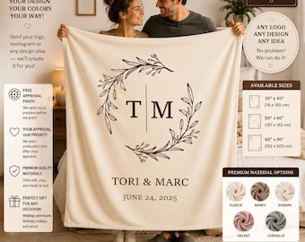May include: A cream-colored custom blanket featuring a dark brown botanical wreath design surrounding the initials T M, with the names TORI & MARC and the date JUNE 24, 2025 printed below. The blanket is displayed with text detailing available sizes.