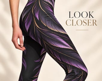 May include: High-waisted leggings featuring a black base with a repeating purple and gold feather pattern. The text LOOK CLOSER is printed in dark brown on the right side. The leggings have a fitted silhouette and a wide waistband.