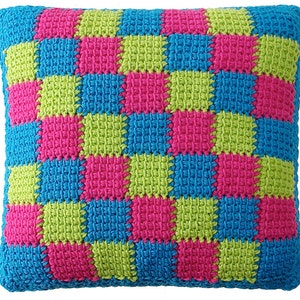May include: A square-shaped pillow with a checkered pattern in bright pink, green, and blue.