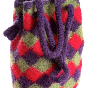 May include: A small, purple, red and green patterned drawstring bag made of felted wool.