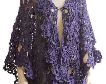 May include: A purple crocheted shawl with a lacy design. The shawl has a button closure at the neck.