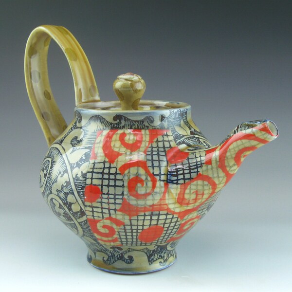 Teapot, ceramic pottery, with cirlces and floral and vine designs