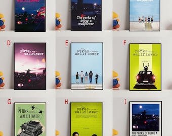 May include: Nine framed movie posters for "The Perks of Being a Wallflower" are displayed. The posters feature various designs, including cityscapes, silhouettes, and group shots. Each poster has a black frame and the movie title.