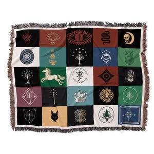 Floating product shot of fantasy patchwork blanket, detailed Lord Of The Rings magical emblems and flags design with fringe trim on white background
