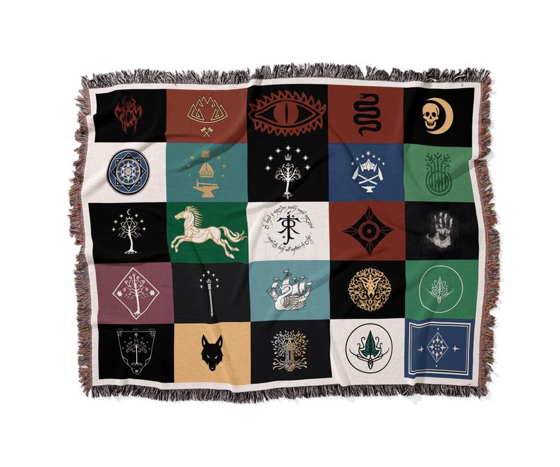 Floating product shot of fantasy patchwork blanket, detailed Lord Of The Rings magical emblems and flags design with fringe trim on white background