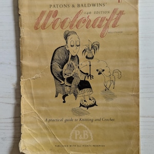 May include: A vintage "Woolcraft" book cover in tan with red and black text and illustrations. The title reads "Woolcraft" with "Patons & Baldwins' 14th Edition" above it. The cover features a cartoon of a woman knitting, a sheep, and the text "A practical guide to Knitting and Crochet."