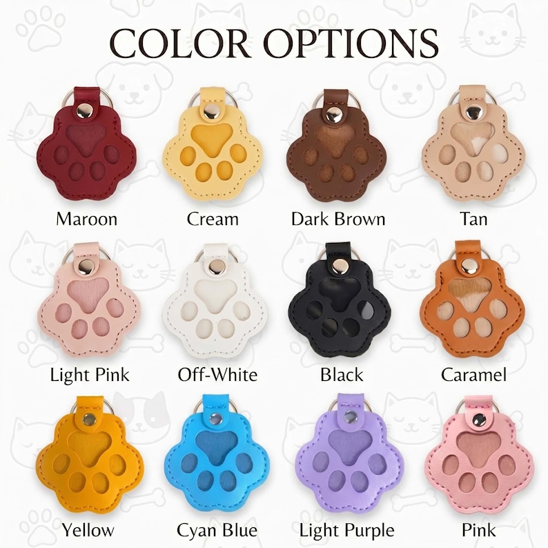 May include: Twelve paw-shaped keychains arranged in a grid, labeled COLOR OPTIONS. Each keychain features a metal snap button and a ring. Colors include maroon, cream, dark brown, tan, light pink, off-white, black, caramel, yellow, cyan blue, light purple, and pink.
