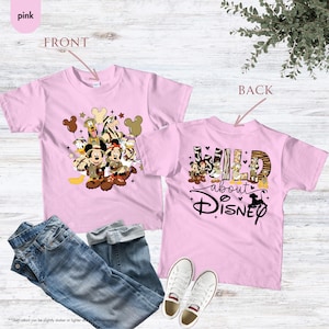 May include: Pink t-shirts with Disney characters. The front of the shirt features Mickey and Minnie Mouse, Donald Duck, and Goofy. The back of the shirt says "Wild about Disney" with a graphic of Disney characters.