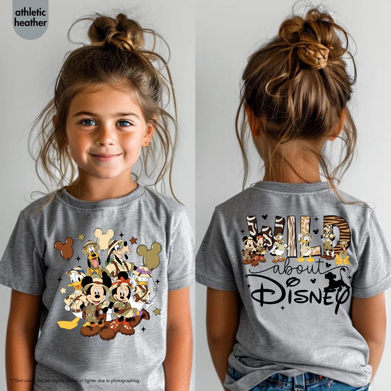 May include: A gray t-shirt featuring a Disney character design on the front and back. The front design includes Mickey and Minnie Mouse, Donald Duck, and Goofy. The back of the shirt says "Wild about Disney".