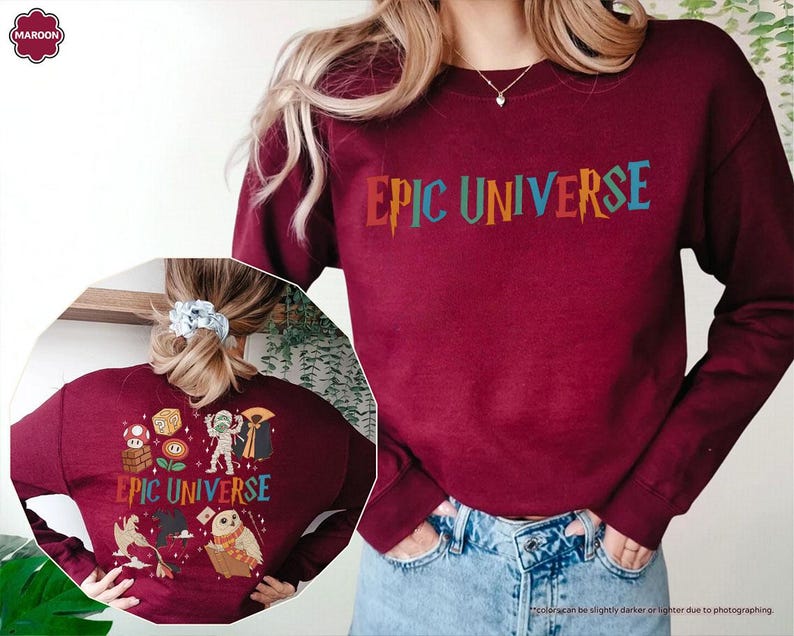 May include: A maroon sweatshirt with the text "EPIC UNIVERSE" in colorful letters. The back of the sweatshirt features various cartoon characters and the same text. The sweatshirt is a long-sleeved, crew neck style.
