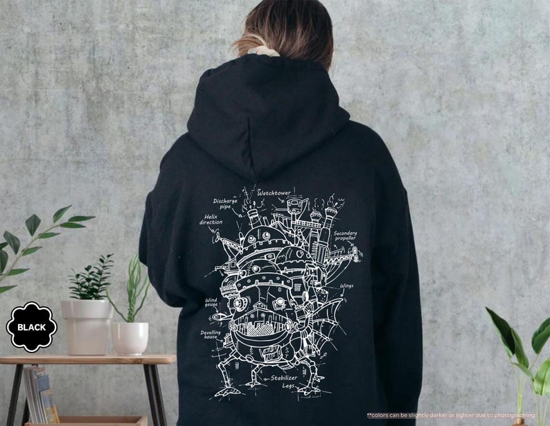 May include: Black hooded sweatshirt with a white graphic print of a detailed drawing of a flying house with the text "Secondary propeller", "Discharge pipe", "Helix direction", "Stabilizer Legs", and "Gustohower" on the back.