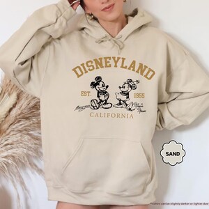 May include: A set of three ceramic mugs with a speckled, matte finish in cream, light grey, and dark grey. Each mug has a simple, minimalist design, ideal for coffee or tea.