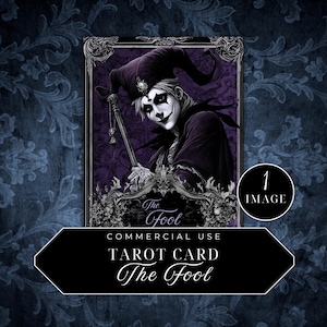 May include: A tarot card depicting The Fool, a jester-like figure with a white face and black eyes, wearing a purple and black costume. The card is framed in a black and gold ornate frame with the words "The Fool" written in a decorative font.