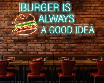 May include: Neon sign with the text "Burger is always a good idea" in blue and green. A cartoon burger with yellow, red, and green colors is on the left side of the sign. The sign is hanging on a brick wall above a row of red chairs in a restaurant.