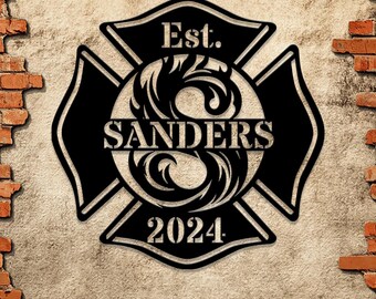 May include: Black metal firefighter's cross with a stylized letter S in the center, the text "SANDERS" and "Est. 2024" around the letter.
