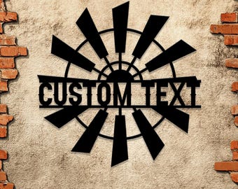 May include: Black metal windmill design with the text "CUSTOM TEXT" in the center.