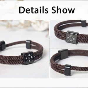 May include: Brown rope bracelet with black square accents. The bracelet features a double-strand design and a central black square with the letters "H", "Y", "B", and "T". The words "Details Show" are at the top of the image.