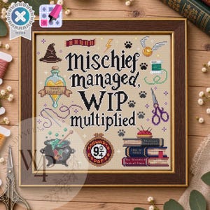 May include: A framed cross-stitch sampler on beige fabric featuring the black text "Mischief managed, WIP multiplied" surrounded by icons including a wizard hat, potion bottle, golden snitch, cauldron, embroidery hoop, and a stack of books.