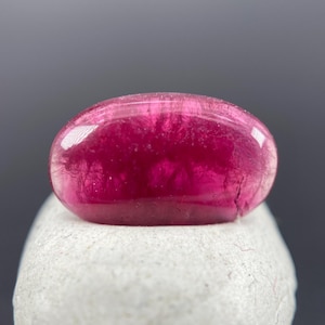 Ultra-Rare Red Beryl Cabochon: 1.60 ct Oval Shape Gemstone, Wah Wah Mountains in Utah, Natural & Untreated