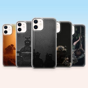 May include: A collection of five phone cases with military-themed designs. The cases feature images of soldiers in action, with a range of colors from orange to black and white. One case has the text "laziness will kill your dreams."
