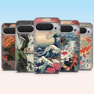 May include: A collection of phone cases featuring Japanese-inspired art. The designs include a waterfall scene, a large ocean wave, a koi fish, and a serene landscape with a red pagoda. Each case has a clear border and a camera cutout.