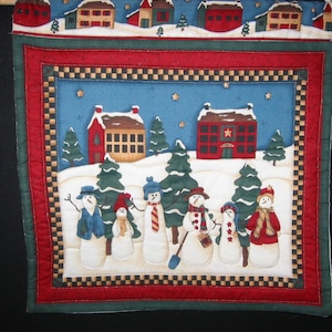 Village snowmen wall hanging