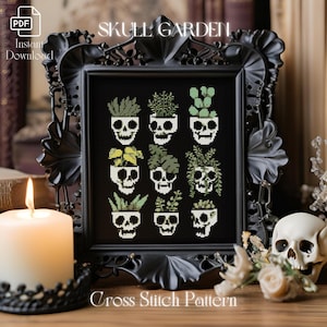 May include: A black and white cross stitch pattern featuring a skull garden with 12 different plants in skull pots. The pattern is titled "Skull Garden" and includes the text "Cross Stitch Pattern".