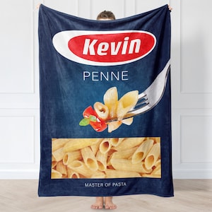 May include: A blue fleece blanket with a red and white logo that says "Kevin Penne Master of Pasta". The logo is on a blue background with a picture of penne pasta on a fork.