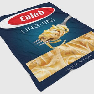 May include: A blue and yellow package of Caleb Linguini pasta. The package features a fork with a portion of linguini pasta on it. The text "Caleb Linguini" is in red and white on a red oval. The text "Master of Pasta" is in white on a blue background.
