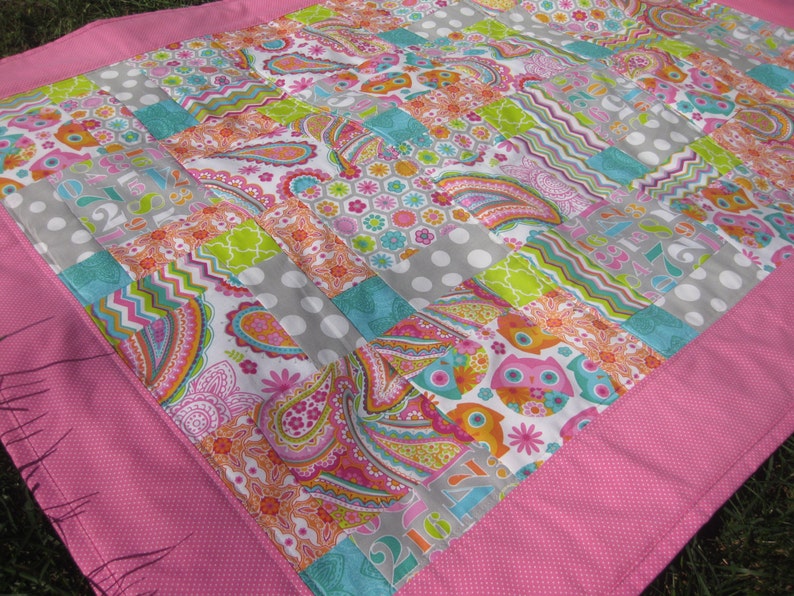 Bright Owls baby quilt in pink teal white and lime green yellow